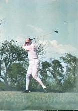 Colorized photo of Dr E W Kirk teeing-off at Fanling