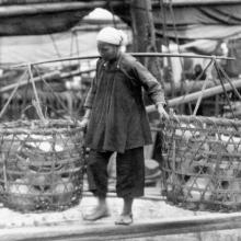 Woman carrying baskets