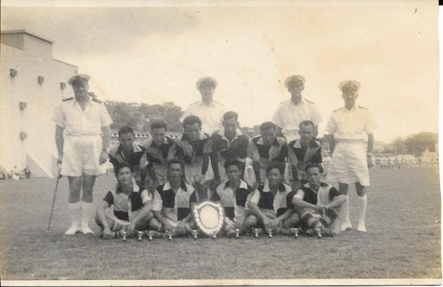 Unknown football team with Naval officers.