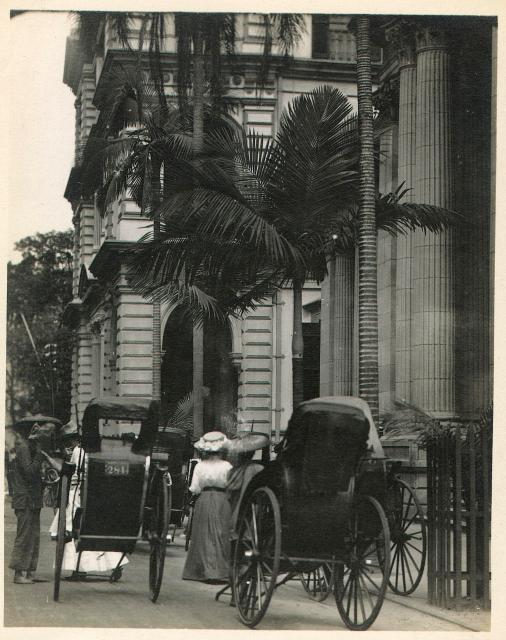A carriage in front of a building