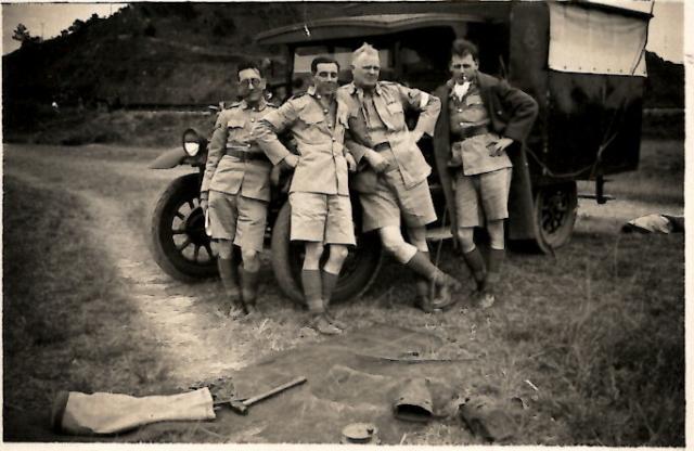 Four Uniformed Individuals by HKVoluteer Force Truck