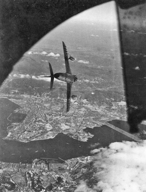 RAF Hawker Hunter diving towards the harbour