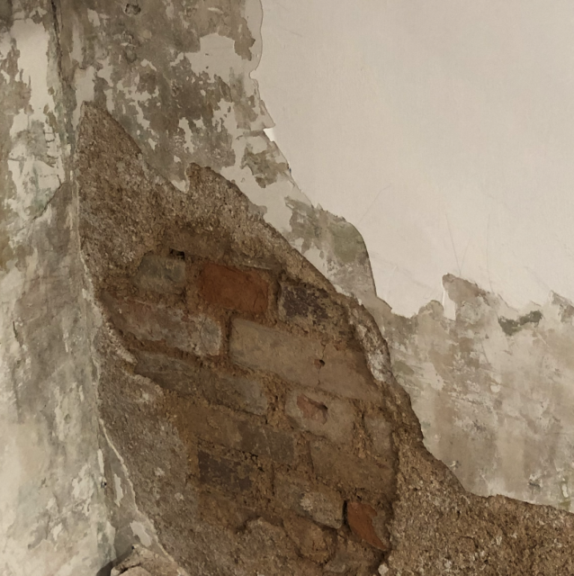 brick wall under plastering