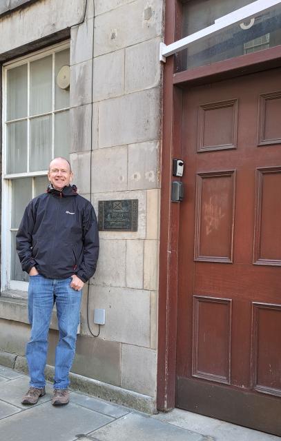 David outside John Thomson's childhood home in Edinburgh