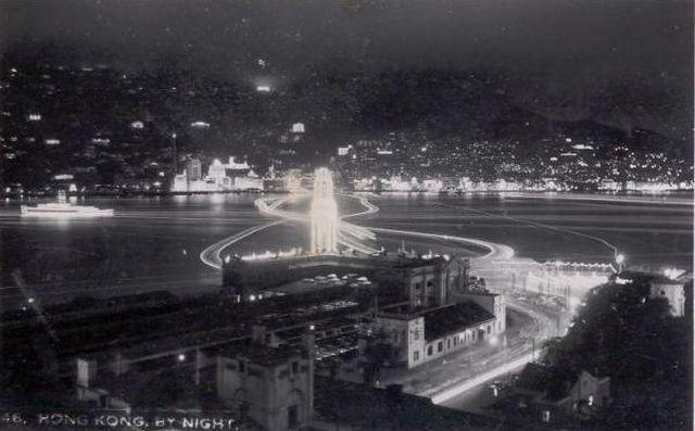 1953 Nighttime view of harbour from TST