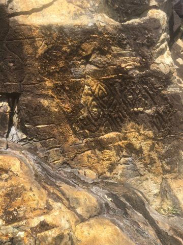 Ancient rock carving on Brick Hill ( Nam Long Shan).