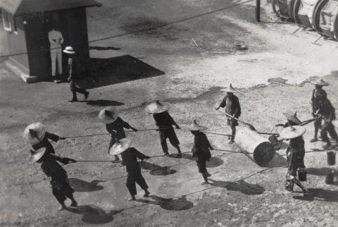 Women road menders, with a roller, Hong Kong 1933