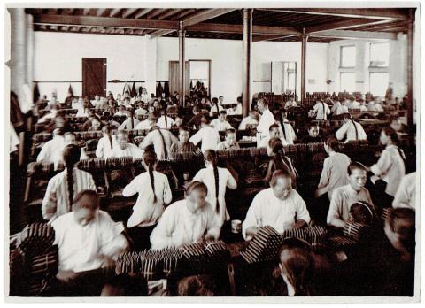 Workers seated at tables