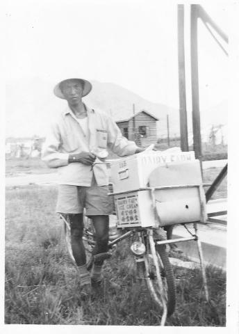 Fruit seller on weekly visit to RAF Sek Kong 1955