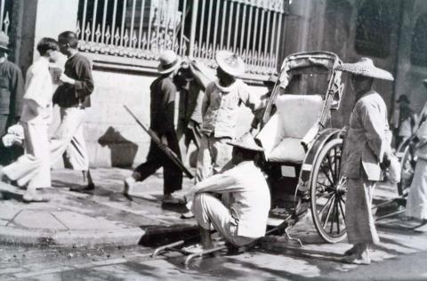 Naval dockyard-rickshaw boys waiting for fares at the entrance 1935