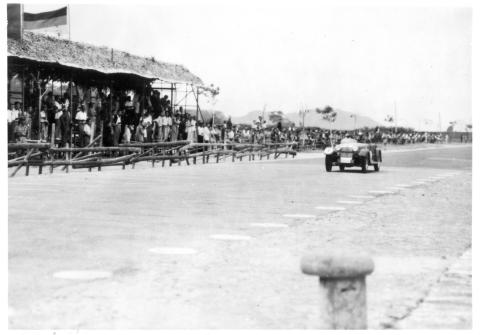 Betsy, well out in front, passing the grandstands at the first Macau GP