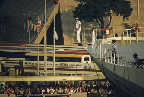Queen Elizabeth 2 about to berth- officer monitors mooring ropes handling June 1997