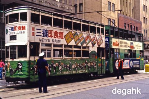 Swinging the trolley pole - Cars 1 & 74 Des Voeux Road Central Sept 1983 