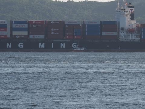 Harbour pilot dropping off container ship