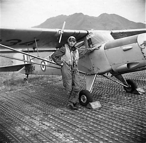 dad his aeroplane 1950s in front of lion rock