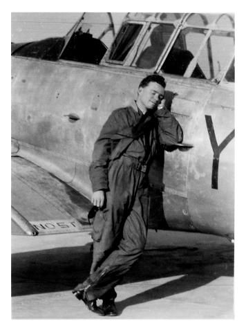 Ian McKelvie in front of his Harvard training plane 1951