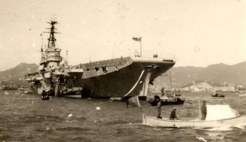 aircraft carrier in hong kong harbour