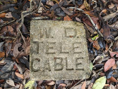 War Department telephone cable marker near Tai Tam Reservoir Recorder House