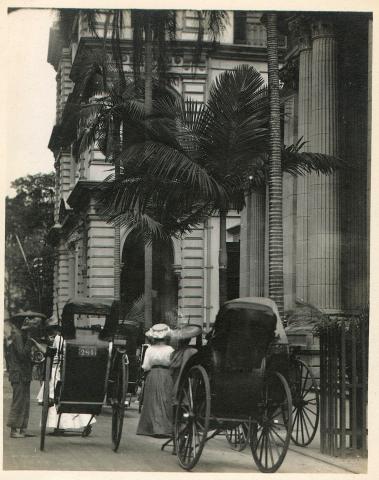 A carriage in front of a building