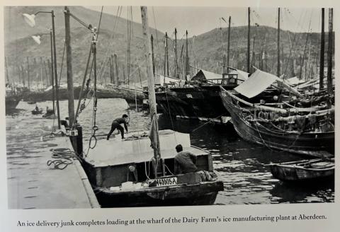 Photo of loading ice blocks onto a boat in the Dairy Farm Aberdeen ice-making plant