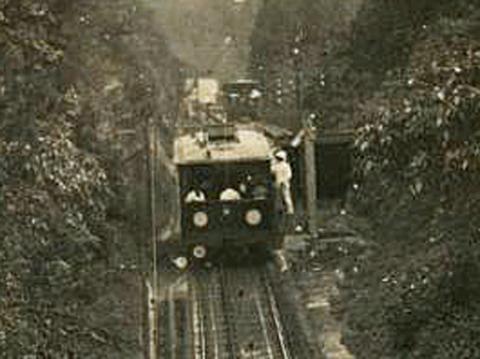 Man in white uniform at the lower entrance to the passing loop