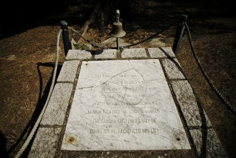 The original memorial stone commemorates Driver Joseph Hughes, GC.