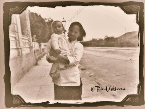 1948 Me with my baby amah whose name I know not.jpg
