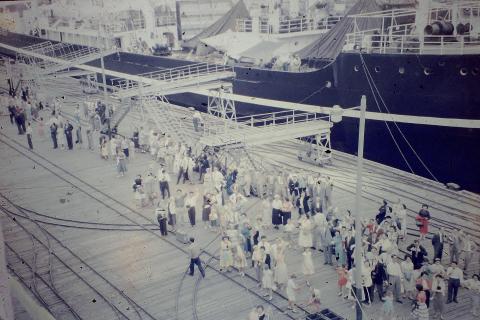 Leaving on the Chusan - families waving goodbye at Kowloon Wharves