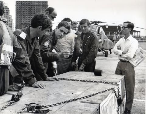 (1) The pilot, Flt Lt Bob Turner, runs through the final briefing points for the lift with his crew