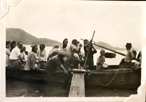 'Homeward Bound!' from Sunset Peak, Lantau Island. Douglas Crozier sits to left (white shirt). 6th from left may be Gladys Fisher. August 1948. Copyright Crozier family.