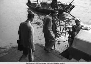 Hong Kong, American evacuees boarding boat with sailors during World War II