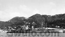 c.1949 HMS London moored at Naval dockyard 