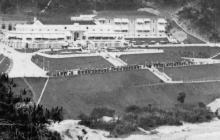 1923 Repulse Bay with cars parked on road in front