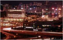 1980s air view at night over hung hom train terminus and Wanchai
