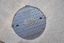 A rare manhole cover at Connaught Road West near Western Street