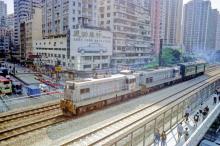 Mongkok-Argyle Street-KCR double headed postal train heading to the border 1995