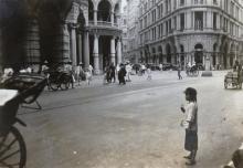 A girl standing on Des Voeux Road, Hong Kong