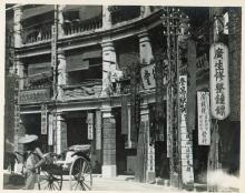 A carriage in front of stores