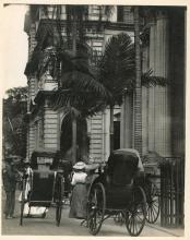 A carriage in front of a building