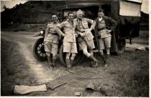 Four Uniformed Individuals by HKVoluteer Force Truck