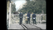 Colourised video frame of newsreel - 2
