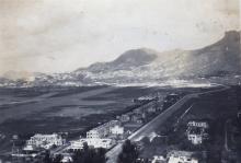 "View of camp with Kawloon City in the background"