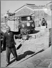 Holland-China Trading Company: portrait of porter and VW T1 delivery van, Hong Kong, ca. 1956