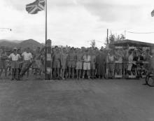 Canadian and British prisoners of war awaiting liberation by the landing party from HMCS Prince Robert, Hong Kong 