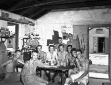 Naval personnel from the HMCS Prince Robert visiting liberated Canadian prisoners of war at Sham Shui Po Camp, Hong Kong 