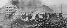 Japanese troops pass Duro Paint factory