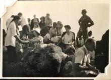 'Supper at Sunset Peak'. 24 August 1948. Includes Ann Crozier (centre right, cardigan on shoulders); Douglas Crozier (foreground right). Others unknown. Copyright Crozier family.
