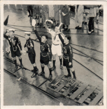 Scouts waving goodbye from dock, location unknown, c1952/53