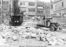 Hong Kong, men working in the middle of building rubble